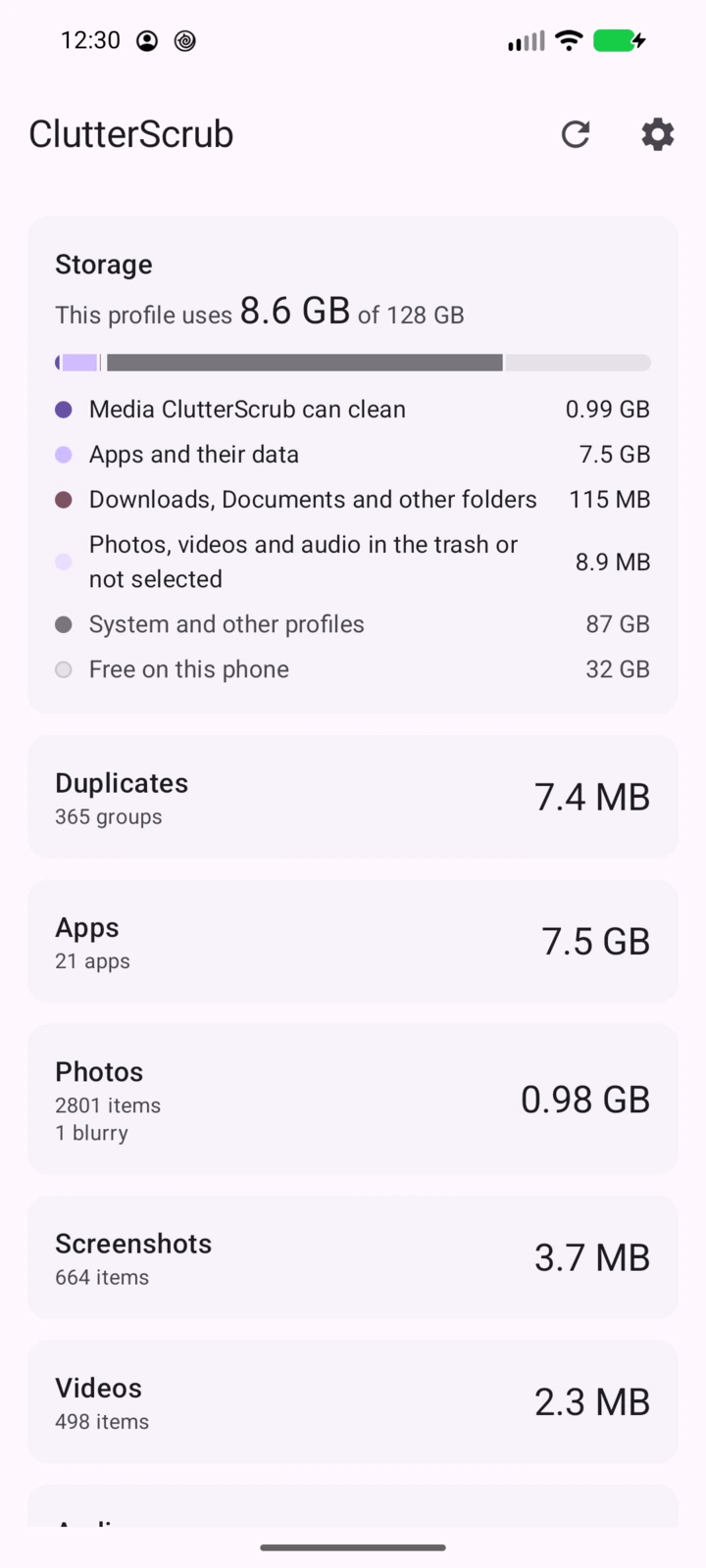 ClutterScrub home screen. The storage card reads This profile uses 8.6 GB of 128 GB, with rows for media ClutterScrub can clean, apps and their data, downloads and other folders, the trash, system and other profiles, and free space. Below it, cards for Duplicates, Apps, Photos, Screenshots and Videos with their sizes.